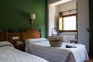 Postel nebo postele na pokoji v ubytování Hotel Infantado
