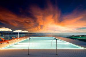 a swimming pool on the roof of a building at TRS Ibiza Hotel - Adults Only in San Antonio
