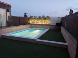 a swimming pool in the backyard of a house at La espiga de la Mata in Segovia