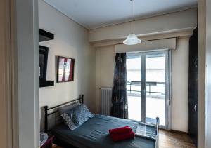 Posteľ alebo postele v izbe v ubytovaní Ami's Appartment in Athens