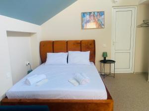 Postel nebo postele na pokoji v ubytování Mose art Hotel