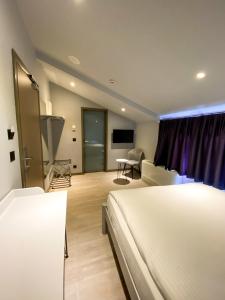a hotel room with two beds and a tv at Eresin Hotels Express in Istanbul
