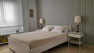 A bed or beds in a room at VERO Granada y PARKING en el edificio