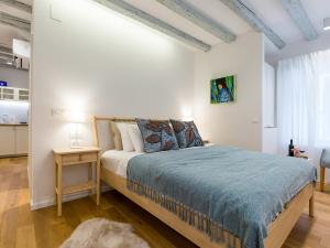 Voodi või voodid majutusasutuse Cozy Montalbano Studios by Irundo toas