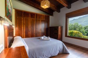 Giường trong phòng chung tại Villa Vacacional Los Nogales