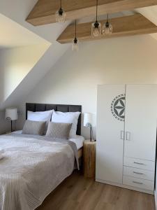 Postel nebo postele na pokoji v ubytování Osada Szczyrk - prywatna sauna & jacuzzi