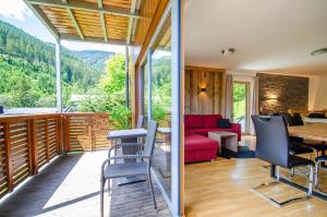 a home with a view of the mountains at Schmitten Finest Apartments by All in One Apartments in Zell am See