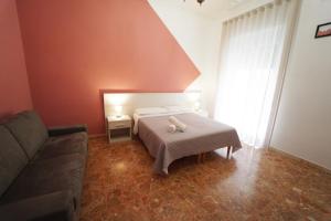 Postel nebo postele na pokoji v ubytování Residence I Due Fratelli