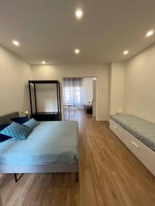 a large bedroom with a bed and a mirror at Casa Vacanze Caramagna 2 in Aci Castello +58 photos