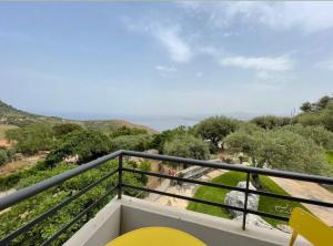 a balcony with a view of the ocean at La Casa del Riccio in Tindari