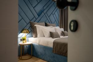 Posteľ alebo postele v izbe v ubytovaní Amélie Luxury Rooms