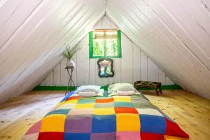 A bed or beds in a room at Muhu Namaste