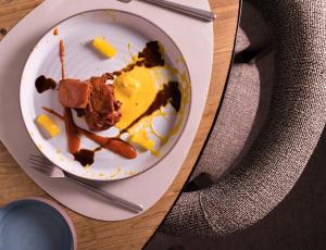a plate with a piece of food on a table at Las Terrazas de Abama Suites in Guía de Isora