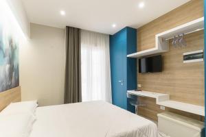 Postel nebo postele na pokoji v ubytování Nuvole Apartment near the beach