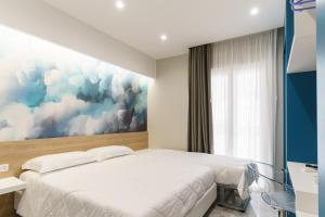 Postel nebo postele na pokoji v ubytování Nuvole Apartment near the beach