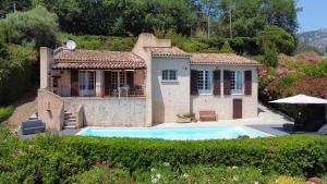 a house with a swimming pool in front of it at Villa Vence in Vence