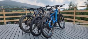 two bikes are parked on a wooden deck at Level780 in Koszarawa