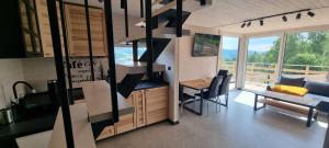 a kitchen and dining area of a tiny house at Level780 in Koszarawa