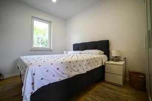 Postel nebo postele na pokoji v ubytování Apartment Bine