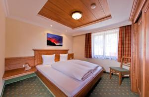 Postel nebo postele na pokoji v ubytování Chalet Tschallener