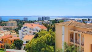 a view of a city with buildings and the ocean at Superb Apartment in Alvor in Alvor