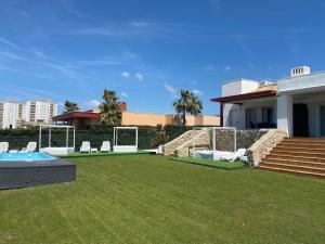 a backyard with a pool and a soccer goal at Altair 11 in El Puerto de Santa María