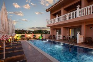 a swimming pool in the middle of a house at Kseynasa Suites in Nikiti