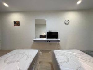 Postel nebo postele na pokoji v ubytování Batumi Hotel R&M