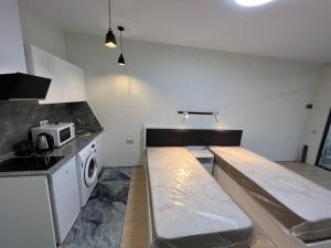 Postel nebo postele na pokoji v ubytování Batumi Hotel R&M