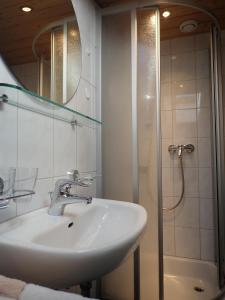 a bathroom with a sink and a shower at Haus Tuklar in Brand +75 photos