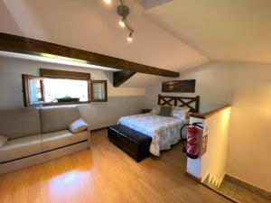 Postel nebo postele na pokoji v ubytování Casa Maribel Cangas de Onís VV-2009-AS