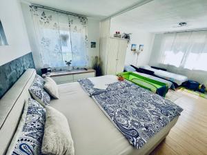 a living room with two beds and a couch at Apartment Messe Karlsruhe in Rheinstetten