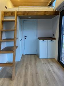 a room with a bunk bed and a closet at Lavira Tiny House Village in Bogazici