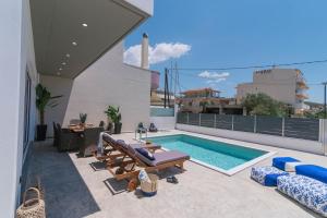 a swimming pool on the roof of a house at Villa Iceberg 2 with Pool in Kalamaki