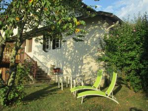 a table and chairs in the yard of a house at Hope's Land - gîte in Onesse-et-Laharie +19 photos
