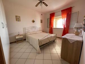Postel nebo postele na pokoji v ubytování Villa Muntiranni