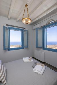 Postel nebo postele na pokoji v ubytování Aegean Muses