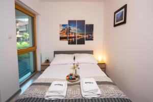 Posteľ alebo postele v izbe v ubytovaní Maya's Flats & Resorts 17 - NADMOTLAWIE