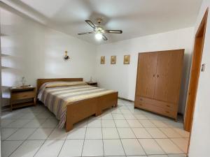 En eller flere senge i et værelse på Villa Muntiranni