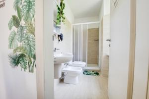 a bathroom with a white toilet and a sink at Esclusivo appartamento storico a ☆☆☆☆☆ - BELLINZONA in Bellinzona