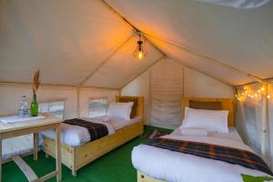 מיטה או מיטות בחדר ב-Bikamp Camp Leh Ladakh