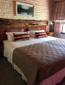 Una cama o camas en una habitación de El Colibrí Cabañas de la Naturaleza