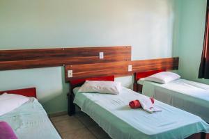 Postel nebo postele na pokoji v ubytování Hotel Pato Branco
