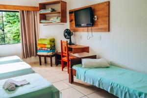 Postel nebo postele na pokoji v ubytování Hotel Pato Branco