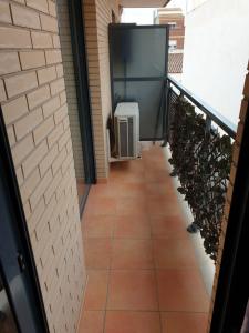a hallway with a balcony with an air conditioner at Apartamento Residencial Carmen in Oropesa del Mar