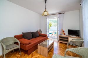 Televízia a/alebo spoločenská miestnosť v ubytovaní Apartments Zarac