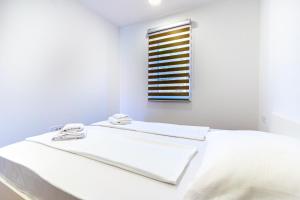 Posteľ alebo postele v izbe v ubytovaní ISLAND GETAWAY