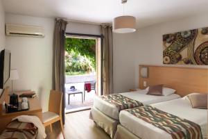Postel nebo postele na pokoji v ubytování Hotel U Ricordu & Spa + 37 fotografií