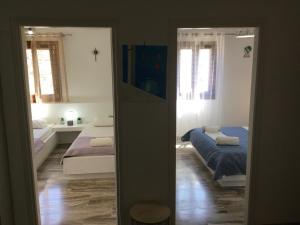 Postel nebo postele na pokoji v ubytování VILLA LEMONIA