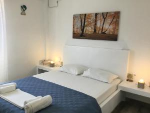 Un pat sau paturi într-o cameră la VILLA LEMONIA
